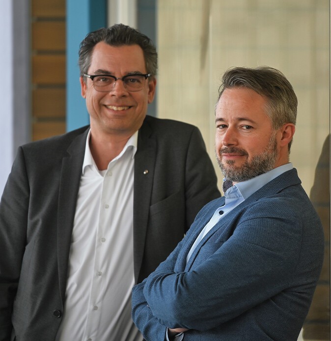 Portrait von Michael Wiedekamp und Alexander Walter